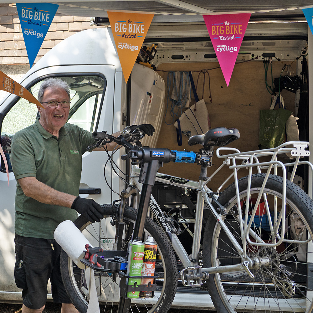 Phil checking out peoples bikes at the Bikes Revived Van at Pippfest 2024